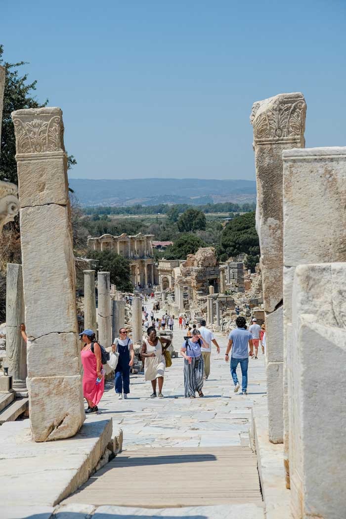 Women Travelers Touring Ancient City Ruins